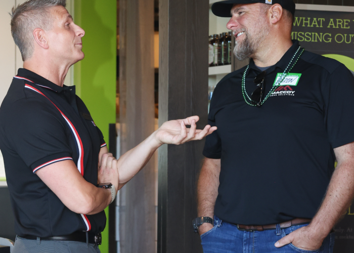 Aaron MacCoy is talking to a person